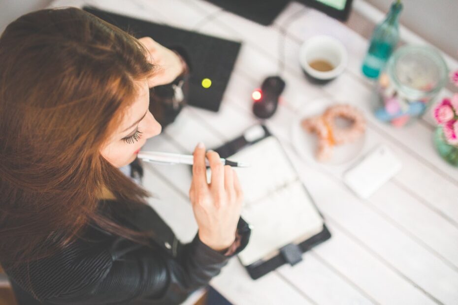 Young woman writing in diary