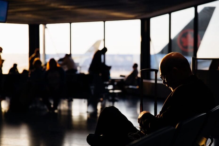 Man waiting for his flight at the gate