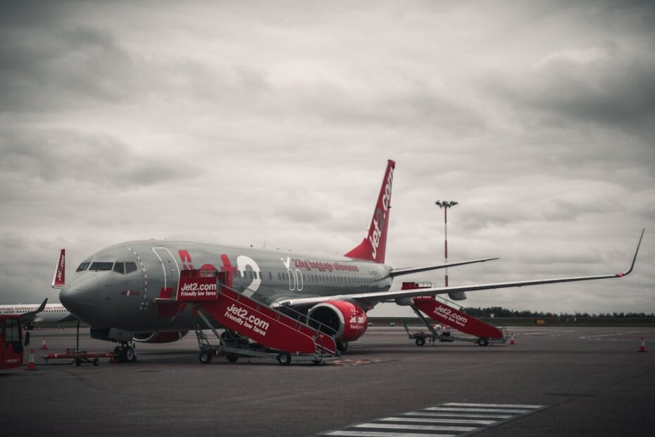 Red and grey plane on the tarmac